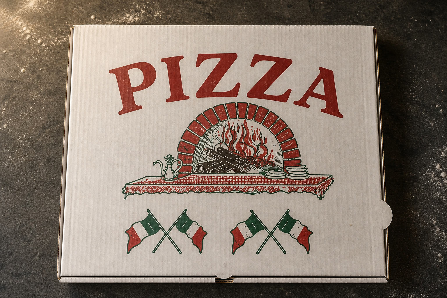 Pizza-Guys-Schachtel auf einer dunklen Steinfläche in unserer Küche